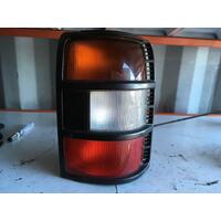 Mitsubishi Pajero NL Right Tail Light In-Body Black Surr. 4DR 09/97-04/00