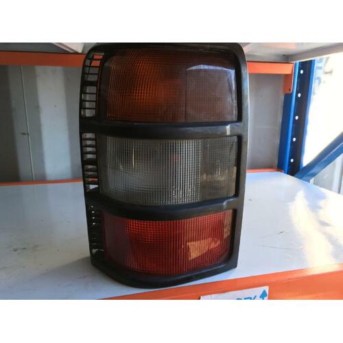 Mitsubishi Pajero NL Left Tail Light In-Body Black Surround 09/1997-04/2000