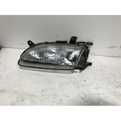 Mazda 323 Left Headlight BA11 KOITO 11/96-08/98