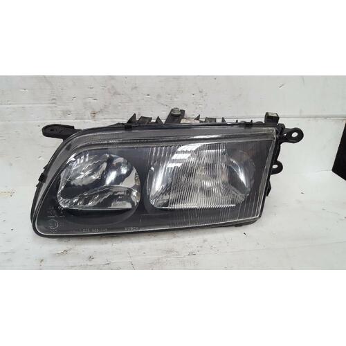 Mazda 626 Left Head Light GF Black Insert 01/1992-08/1997